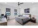 Comfortable bedroom with a water view, ceiling fan, and a dedicated desk area at 5811 Mariner St, Tampa, FL 33609