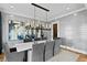 Sophisticated dining room with elegant lighting, modern artwork, and a dining table perfect for hosting gatherings at 5811 Mariner St, Tampa, FL 33609