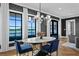 Elegant dining room featuring views, stylish chandelier, and designer wallpaper at 5811 Mariner St, Tampa, FL 33609