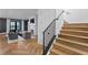 Light-filled entryway with modern staircase leading to a large Gathering room with fireplace and large windows at 5811 Mariner St, Tampa, FL 33609