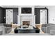 Gathering room with fireplace, hardwood floors and stylish seating at 5811 Mariner St, Tampa, FL 33609