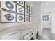 Hallway and laundry room with marble counter and modern abstract paintings on wall at 5811 Mariner St, Tampa, FL 33609