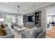 Comfortable living room with custom built-ins, neutral colors, and hardwood flooring at 5811 Mariner St, Tampa, FL 33609