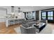 Spacious living area featuring modern decor, open floor plan, and access to outdoor views at 5811 Mariner St, Tampa, FL 33609