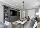 Elegant living room featuring custom built-ins, plush seating, and sophisticated contemporary lighting at 5811 Mariner St, Tampa, FL 33609