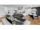 Open-concept living area connecting the kitchen, living room, and dining space, with modern decor and ample natural light at 5811 Mariner St, Tampa, FL 33609