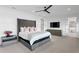Spacious main bedroom with plush carpet, ceiling fan, and modern decor at 5811 Mariner St, Tampa, FL 33609