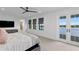 Light-filled main bedroom with water views and access to a private balcony through french doors at 5811 Mariner St, Tampa, FL 33609