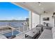 Covered patio featuring lounge seating, an outdoor grill, and scenic waterfront views at 5811 Mariner St, Tampa, FL 33609