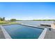 Stunning waterfront pool overlooking the serene bay, complete with a private dock for ultimate relaxation at 5811 Mariner St, Tampa, FL 33609