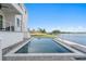 Inviting backyard pool overlooking the water, perfect for relaxation and entertaining at 5811 Mariner St, Tampa, FL 33609