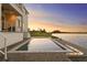 Stunning waterfront pool with fire feature, perfect for relaxing and entertaining at twilight at 5811 Mariner St, Tampa, FL 33609