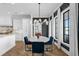 Elegant dining area with water views and a modern chandelier at 5811 Mariner St, Tampa, FL 33609