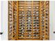 Custom wooden wine rack providing ample storage in a dedicated space at 5811 Mariner St, Tampa, FL 33609