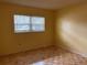 Bedroom with hardwood floors and window at 820 Virginia St # 207, Dunedin, FL 34698
