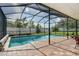 Inviting screened-in pool with plenty of space for relaxation at 8432 White Poplar Dr, Riverview, FL 33578