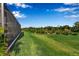 Screened patio area and grassy backyard at 10336 Wynward Way, Parrish, FL 34219