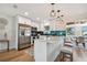 Modern kitchen with stainless steel appliances and white shaker cabinets at 10721 64Th Ave, Seminole, FL 33772