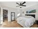 Spacious bedroom with hardwood floors and ceiling fan at 10721 64Th Ave, Seminole, FL 33772