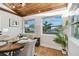 Charming dining area with wood-beamed ceiling and large windows at 10721 64Th Ave, Seminole, FL 33772
