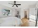Light and airy bedroom with hardwood floors and access to bathroom at 10721 64Th Ave, Seminole, FL 33772