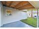 Covered back patio with view of backyard at 10721 64Th Ave, Seminole, FL 33772