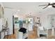 Modern kitchen features white cabinets and teal backsplash at 10721 64Th Ave, Seminole, FL 33772
