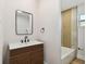 Updated bathroom with modern vanity and bathtub at 10721 64Th Ave, Seminole, FL 33772