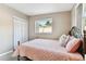 Bedroom with double bed and sliding door at 10763 109Th Way, Largo, FL 33778