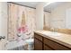 Charming bathroom with a unicorn-themed shower curtain at 10836 Standing Stone Dr, Wimauma, FL 33598