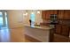 Open kitchen with granite countertops and an island at 12425 Fairlawn Dr, Riverview, FL 33579