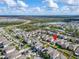 Aerial view of the house and surrounding community at 17036 Peaceful Valley Dr, Wimauma, FL 33598