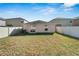 Good-sized backyard with grassy area and a privacy fence at 17036 Peaceful Valley Dr, Wimauma, FL 33598