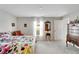 Spacious bedroom with a queen bed and dresser at 17036 Peaceful Valley Dr, Wimauma, FL 33598