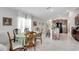 Open concept dining area with kitchen view at 17036 Peaceful Valley Dr, Wimauma, FL 33598