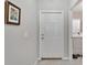 Bright entryway with tile flooring and access to laundry at 17036 Peaceful Valley Dr, Wimauma, FL 33598