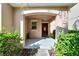 Inviting front entry with covered porch and landscaping at 17036 Peaceful Valley Dr, Wimauma, FL 33598