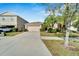 One-story house with a two-car garage and well-maintained landscaping at 17036 Peaceful Valley Dr, Wimauma, FL 33598