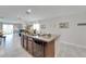 Kitchen island with sink and dishwasher at 17036 Peaceful Valley Dr, Wimauma, FL 33598
