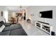 Open living room with view of dining area at 17036 Peaceful Valley Dr, Wimauma, FL 33598