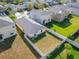 Aerial view of a house and surrounding neighborhood at 17036 Peaceful Valley Dr, Wimauma, FL 33598