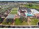 Aerial view of community with clubhouse, pool, and recreation areas at 1715 S Pebble Beach Blvd, Sun City Center, FL 33573