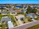 Aerial view of a residential neighborhood with houses and lush landscaping at 1715 S Pebble Beach Blvd, Sun City Center, FL 33573