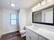 This is a bathroom with white walls, a window, and a toilet at 1715 S Pebble Beach Blvd, Sun City Center, FL 33573