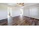 Bedroom with hardwood floors, closet, and plenty of space at 1715 S Pebble Beach Blvd, Sun City Center, FL 33573