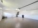 Large garage with epoxy flooring, sink and storage at 1715 S Pebble Beach Blvd, Sun City Center, FL 33573