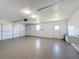 Garage featuring epoxy flooring, utility sink and storage at 1715 S Pebble Beach Blvd, Sun City Center, FL 33573