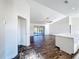 Open floor plan featuring vaulted ceilings, hardwood floors, and sliding glass doors for natural light at 1715 S Pebble Beach Blvd, Sun City Center, FL 33573