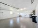 Garage with epoxy flooring and extra storage space at 1715 S Pebble Beach Blvd, Sun City Center, FL 33573