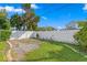 Fenced backyard with gravel and small landscaping at 3401 W North B St, Tampa, FL 33609